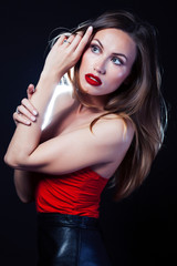 Fototapeta premium young lady posing emotional on black background, lifestyle people concept