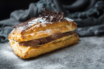 Puff pastry with confectioner's sugar and chocolate filling