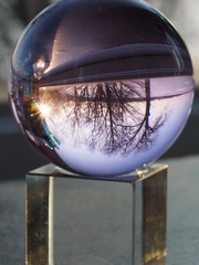 Winter View of Frozen Lake through Glass Sphere