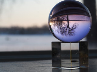 Winter View of Frozen Lake through Glass Sphere