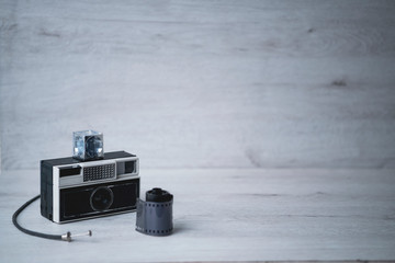 vintage camera on a wood background..