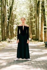 Naklejka premium Elegant lady in black vintage dress lifestyle portrait in pak valley