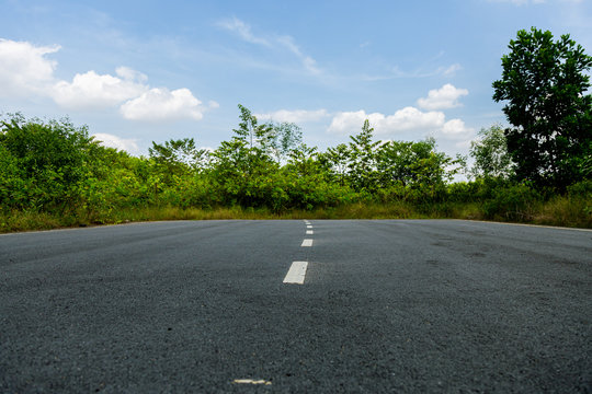 A road to nowhere in the Malaysian rainforest. The street was build but the destination didn't exist, construction of the road stopes suddenly and the road ends in the jungle of Putrajaya, Malaysia.