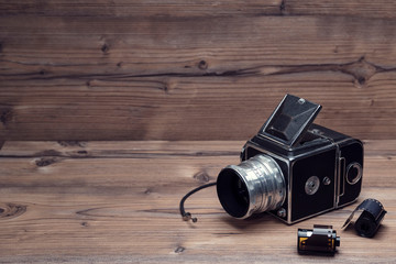 vintage camera on a wood background..