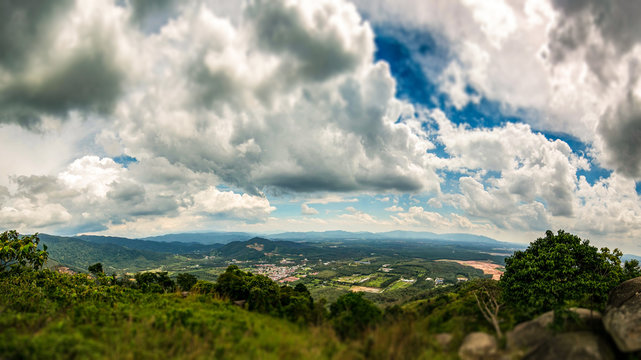 On the top of Broga Hill, Selangor, Malaysia. Tilt shift view over the Landscape of Selangor from top of the mountains. Aerial view over the wide horizon. Blue Sky and white clouds