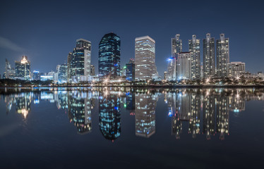 Fototapeta na wymiar Benjakiti Park Lake Reflection of Skyscrapers at Night in Bangkok, Thailand