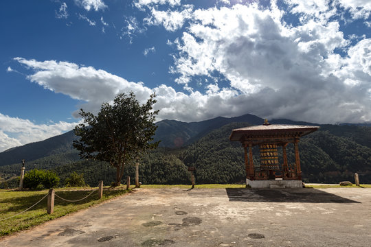 A Buddhistic prayer drum in the mountains of Buthan. The translation of the  symbols on the drum are prosperity, holiness and the mantra of Buddhism or the the teachings of buddhism