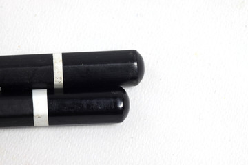 Graphite wooden pencil on an isolated white background