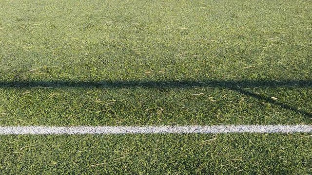 Artificial grass football field; Slow motion