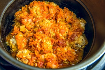 Beef meatballs with tomato sauce in a saucepan. fast cooking