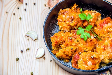Beef meatballs with tomato sauce in a saucepan. fast cooking