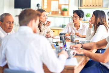 Group of business workers working together at the office
