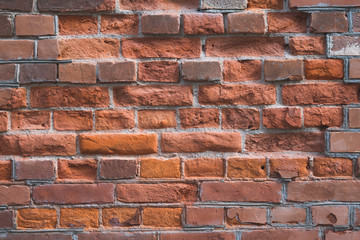 Weathered stained old brick wall background