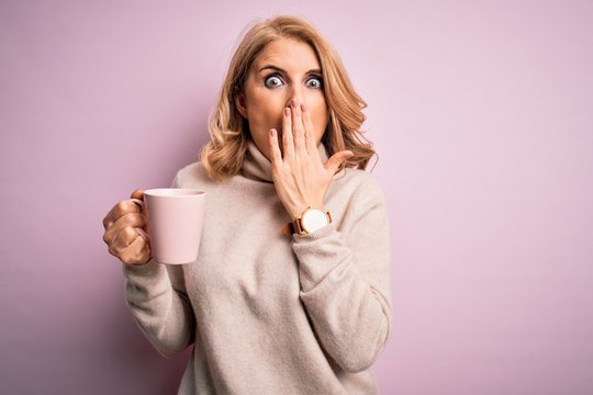 Middle Age Beautiful Blonde Woman Drinking Pink Mug Of Coffee Over Isolated Background Cover Mouth With Hand Shocked With Shame For Mistake, Expression Of Fear, Scared In Silence, Secret Concept