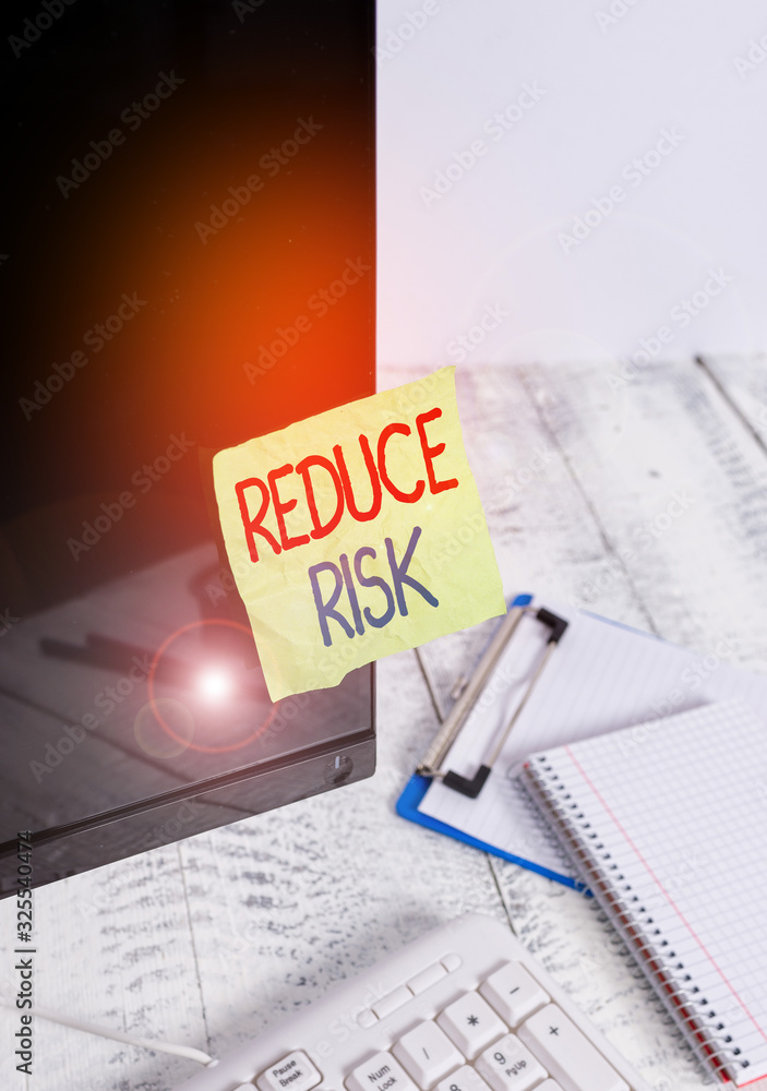 Poster writing note showing reduce risk. business concept for lessen the potential damage that could be cau