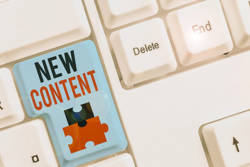 Writing note showing New Content. Business concept for fresh valuable and relevant information or...