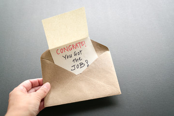 Congrats you got the job message in an envelope. Work or employment concept.