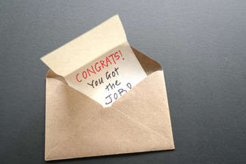 Congrats you got the job message in an envelope. Work or employment concept.