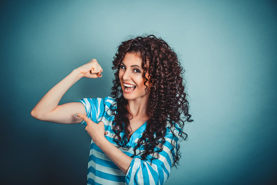 I Am Strong, I Can Do It. Strong Curly Woman Showing Bicep