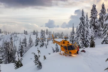 Muurstickers North Vancouver, British Columbia, Canada. North Shore Search and Rescue are rescuing a man skier in the backcountry of Seymour Mountain with a helicopter in winter during sunset. © edb3_16