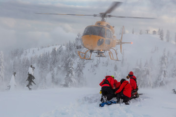 North Vancouver, British Columbia, Canada. North Shore Search and Rescue are rescuing a man skier...