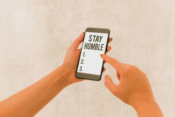 Text sign showing Stay Humble. Business photo showcasing not proud or arrogant Modest to be humble...