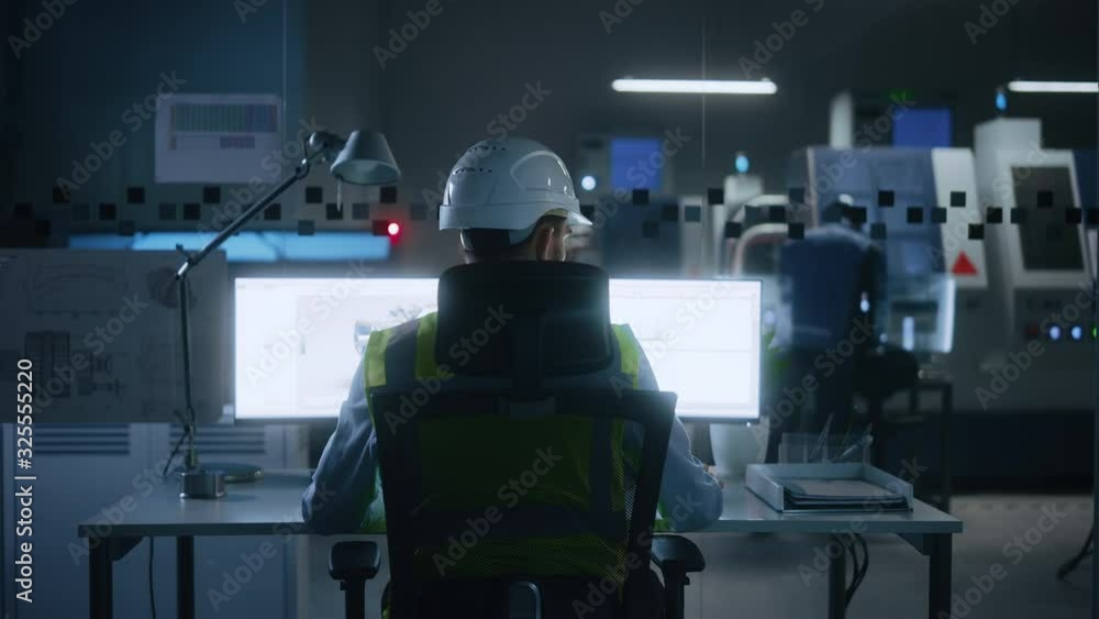 Poster Industrial Engineer Solving Problems, Working on a Personal Computer, Two Monitor Screens Show CAD Software with 3D Prototype of Eco-Friendly Electric Engine Concept. Back View Zoom in