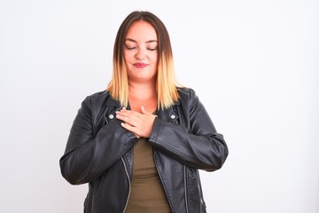 Young beautiful woman wearing t-shirt and jacket standing over isolated white background smiling with hands on chest with closed eyes and grateful gesture on face. Health concept.