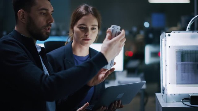 Industry 4.0 Modern Factory: Team of Innovative Industrial Engineers Use Computer and 3D Printer to Build Complex Component. Group of Scientists Use High-Tech Machinery for Futuristic Design