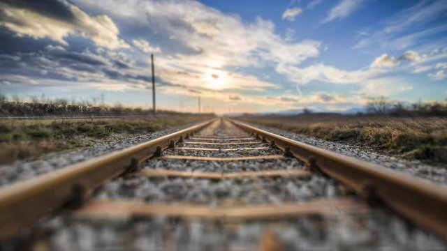 4K Forwarding low angle train rail perspective in motion - landscape travel and transport background