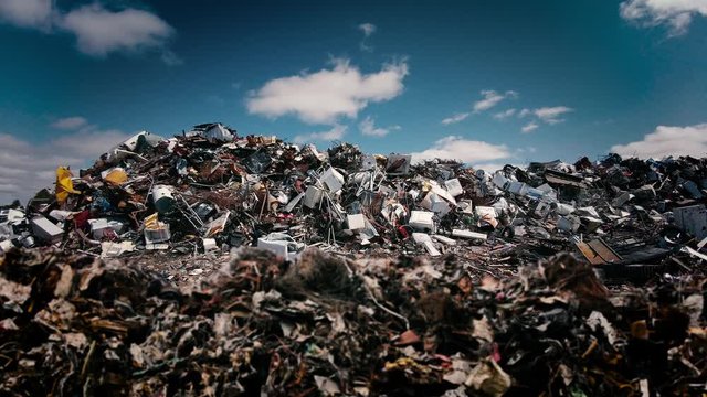 Ecology problem background of stinky rubbish bottles and plastic garbage waste piled up in a landfill of debris