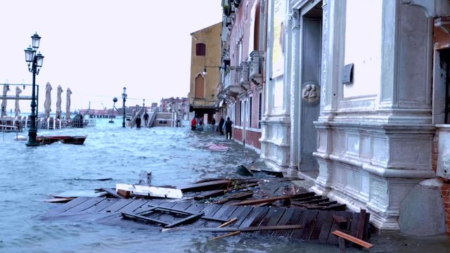 Garbage dragged by the high tide on the streets of Venice. 4k