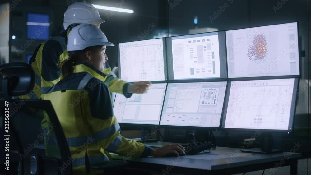 Poster Industry 4.0 Modern Factory: Project Engineer Talks to Female Operator who Controls Facility Production Line, Uses Computer with Screens Showing AI, Machine Learning Enhanced Assembly Process