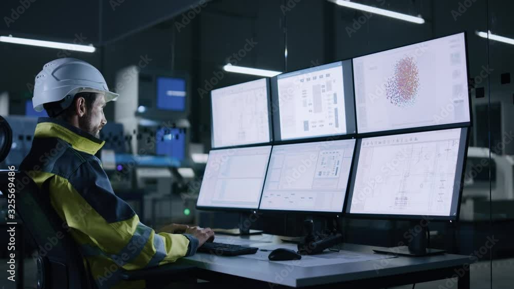 Poster Industry 4.0 Modern Factory: Facility Operator Controls Workshop Production Line, Uses Computer with Screens Showing Complex UI of Machine Operation Processes, Controllers, Machinery Blueprints