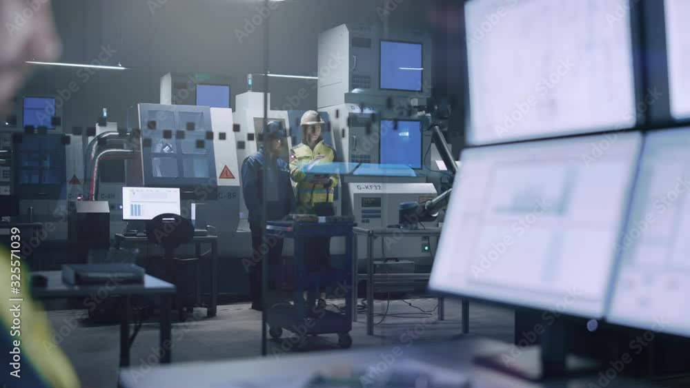 Leinwandbilder Workshop: Specialists Programming Robot Arm for Industrial Production Line. Factory Office: Operator Controls Workshop Assembly Line, Uses Computer with Screens Showing Machine Operation UI 