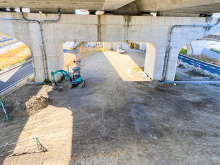 Fence construction under a bridge in Japan.