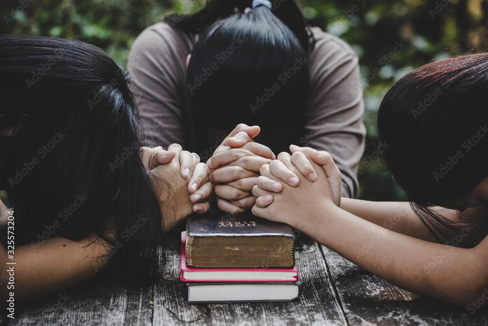 Wall mural group of different women praying together