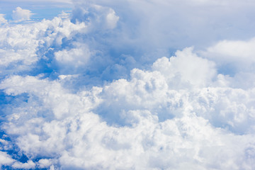 View of clouds and sky from airplane window