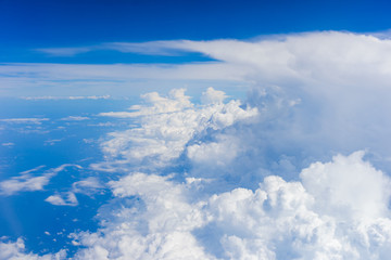 View of clouds and sky from airplane window