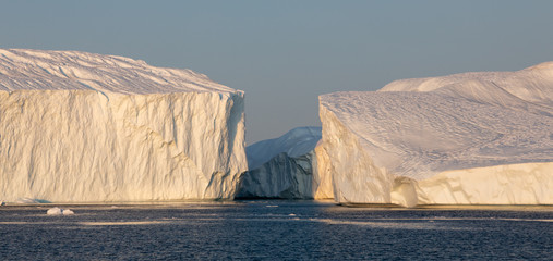 Ice glaciers in Diski Bay during the midnight sun, Ilulissat Icefjord, Greenland © Heather