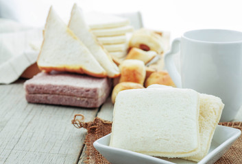 Bread in plate on table.
