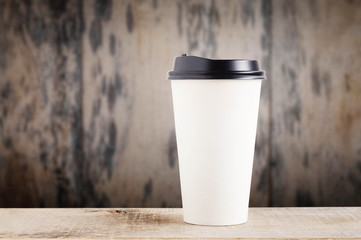 Paper cup on wooden.