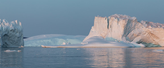 Ice glaciers in Diski Bay during the midnight sun, Ilulissat Icefjord, Greenland