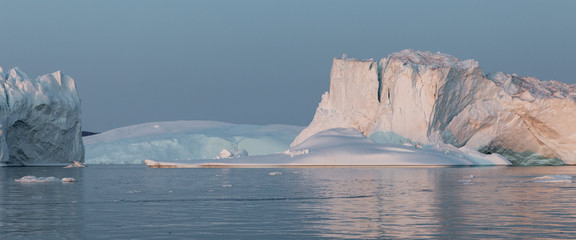 Ice glaciers in Diski Bay during the midnight sun, Ilulissat Icefjord, Greenland