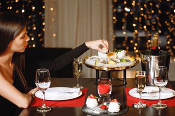 Woman at a dinner party in a restaurant.