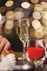 Glass of wine and blurry lights