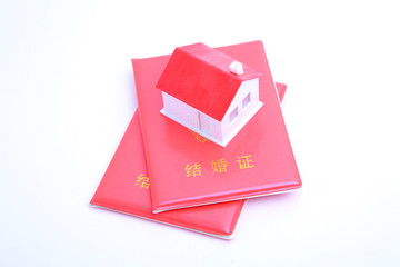 Marriage certificate and house model