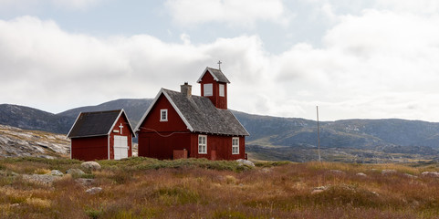Fototapeta na wymiar Ilimanaq settlement church, Western Greenland formerly known as Claushavn