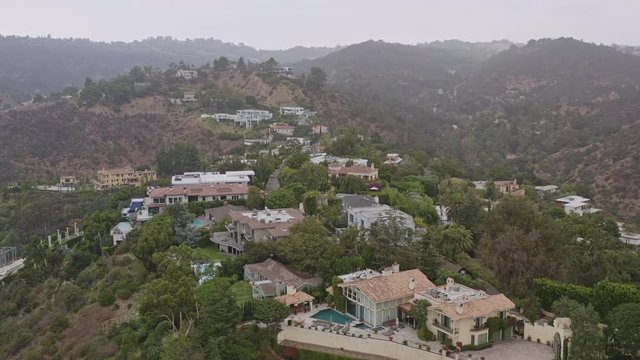 Los Angeles Aerial v272 Panning around hillside mansions moving close up - October 2019