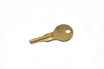A brass cam lock key, close up, isolated on a clean, white background.  Shot in macro.
